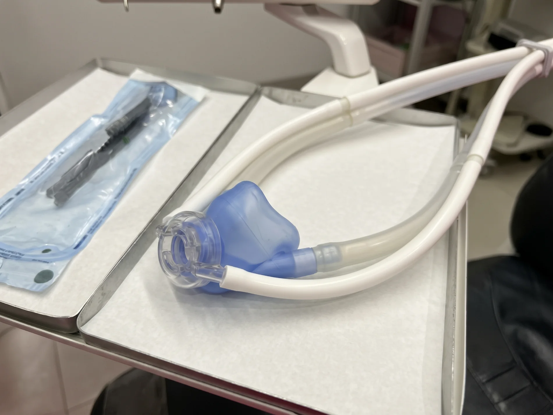 A relaxed patient breathing nitrous oxide during a dental visit